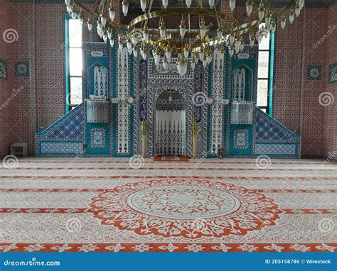 View Inside a Mosque with a Beautiful Carpet and Chandelier Lamp on the ...