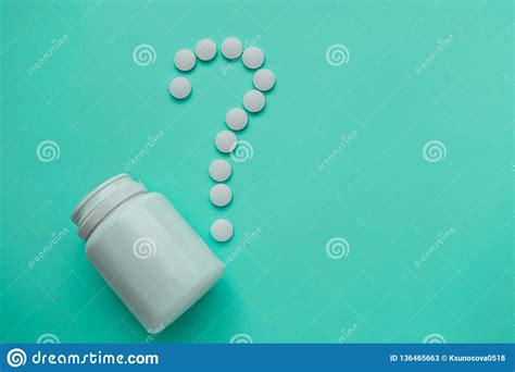 Medicines White Round Heart Shaped Pills On Turquoise Background Stock