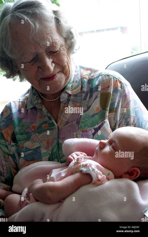 Great Grandmother Holding Great Granddaughter Stock Photo Alamy