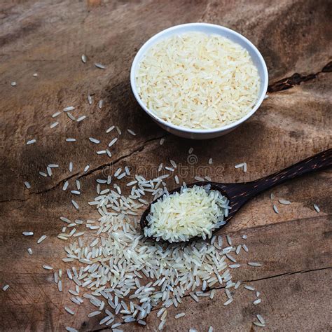 Rice With Wooden Spoon And White Cup On Wooden Stock Image Image Of