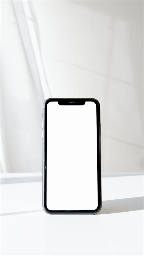 Latest Cellphone in White Screen on a White Surface · Free Stock Photo