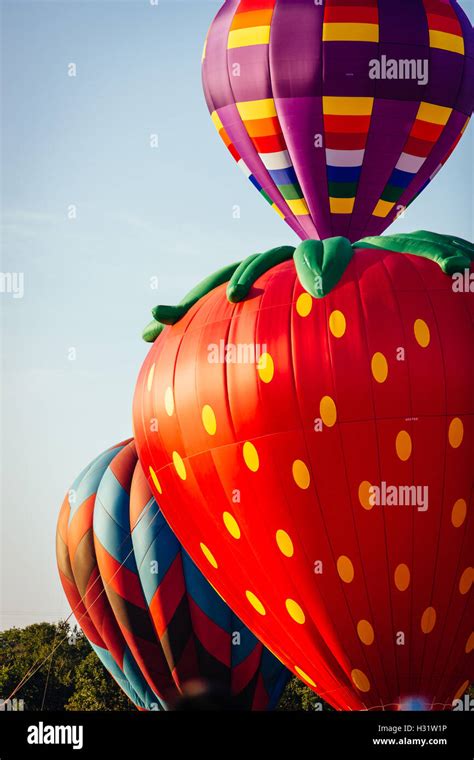 Three Colorful Hot Air Balloons Lifting Off Stock Photo Alamy