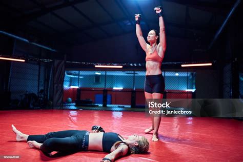 Female Mma Fighters Training In Octagon Knock Out Stock Photo ...