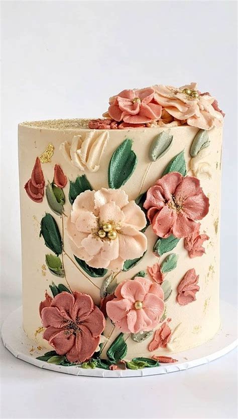 a close up of a cake with flowers on it