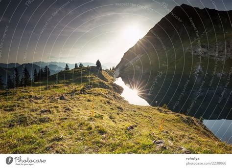 sunset over alpine lake and mountain peaks, Germany - a Royalty Free ...