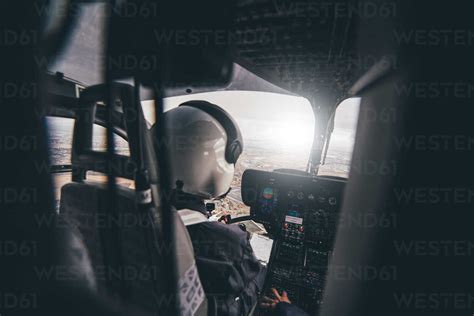 Police pilot during the helicopter flight stock photo