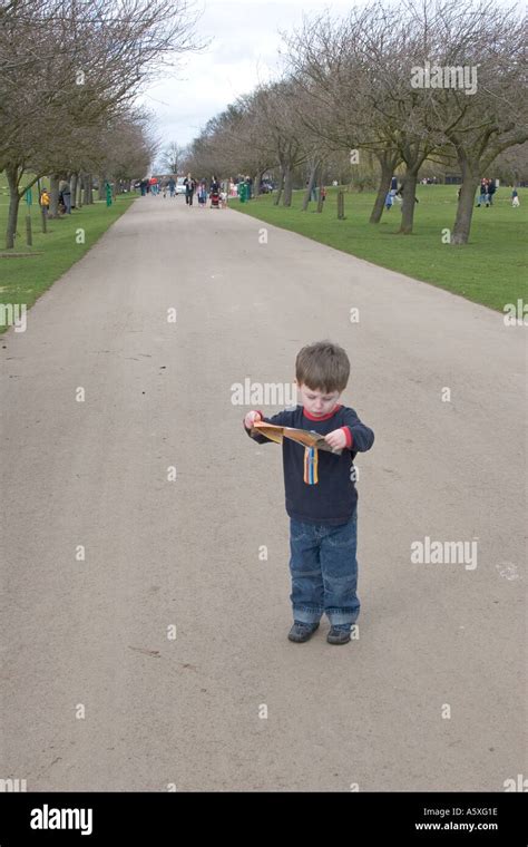 Child lost reading a Map Stock Photo - Alamy