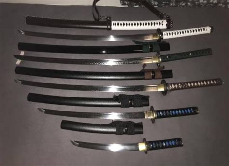 my current katana collection (sorry about the picture quality) : r/Katanas