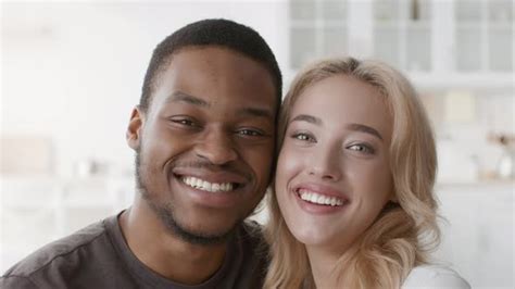 Happy Multiracial Couple Smiling To Camera Posing Indoors Stock Footage