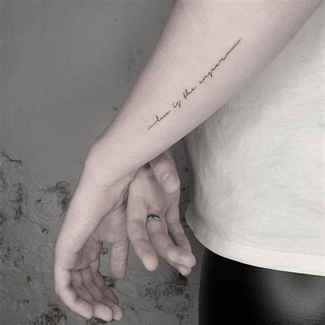 Love Is The Answer Lettering Tattoo Located On The