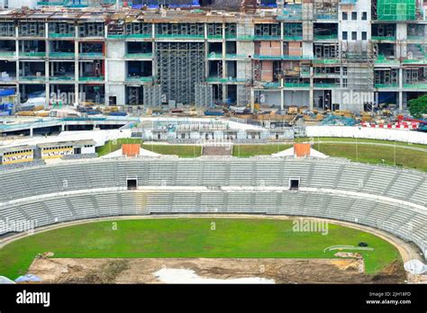 An aerial shot of a stadium with empty seats and under construction ...