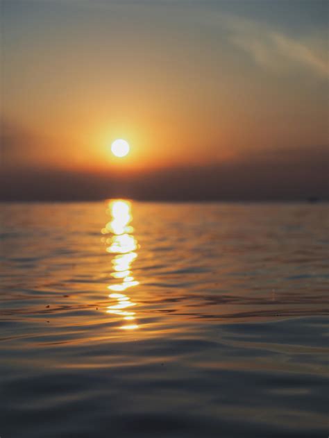 Reflection of the Sun on Water Surface During Sunset · Free Stock Photo