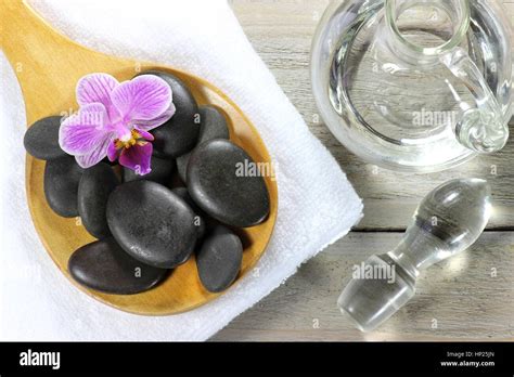 Basalt Stones For Hot Stone Massage With Accessories On Wooden