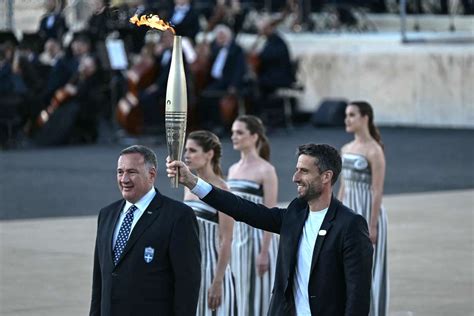 Greece Hands Olympic Flame Over To Paris Games Hosts Flashscore