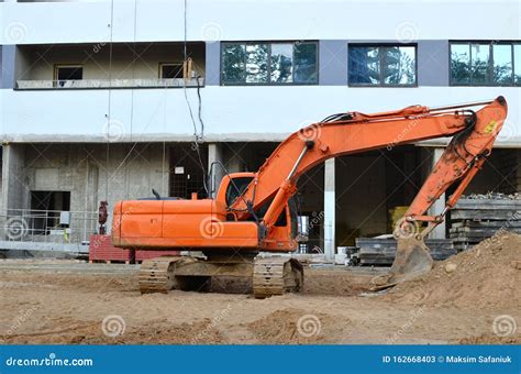 Excavator At A Construction Site During Earthworks And Laying Of