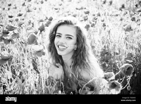 Girl In Field Of Poppy Seed Stock Photo Alamy