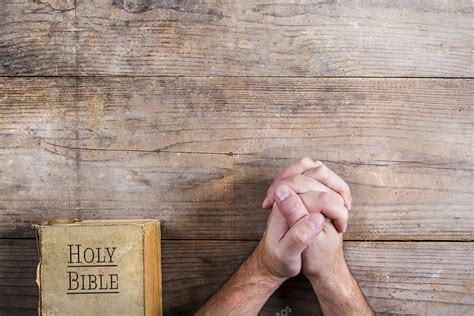 Hands Of Praying Man With Bible Stock Photo Halfpoint 66354533