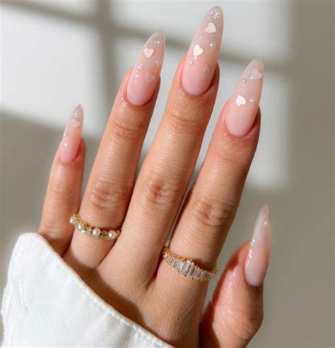 Glossy Nude Almond Nails With Iridescent Hearts Valentine S Day Nails