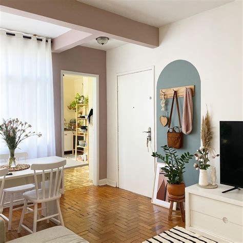 A Living Room Filled With Furniture And A Flat Screen Tv Sitting On Top