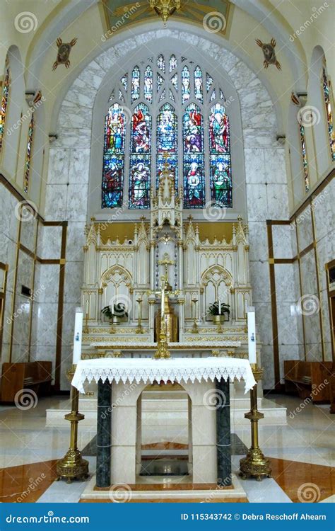 Alter And Stained Glass Windows Under High Beautiful Vaulted Ceiling