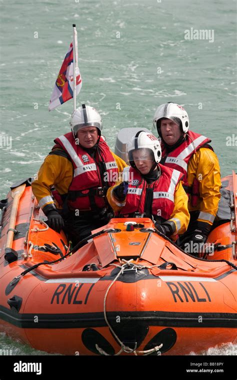 Rnli Royal National Lifeboat Institution Crew Members In A Boat