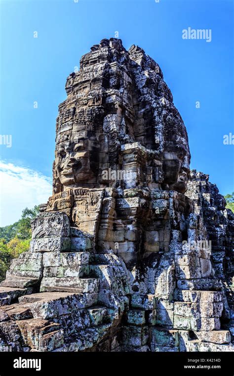 Giant Stone Faces Of Ancient Buddhist Khmer Bayon Temple In Angkor Thom