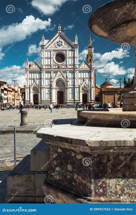 The Basilica Of Santa Croce And The Fountain In Santa Croce Square In