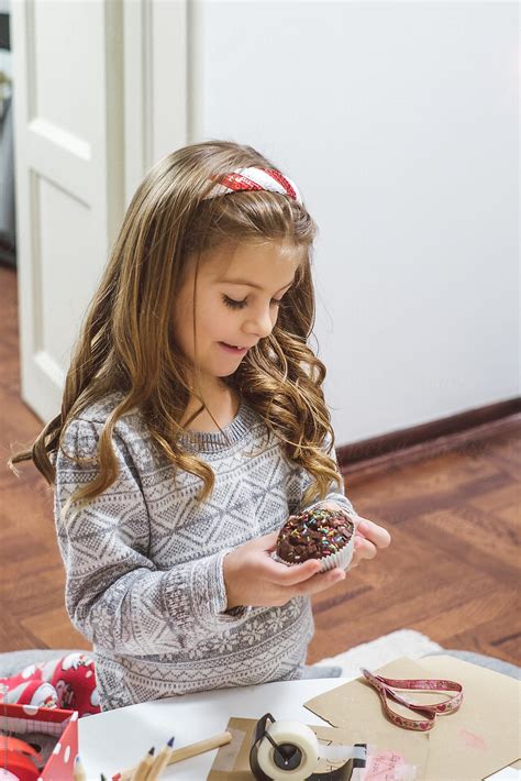 "Cute Little Girl Eating Cupcake" by Stocksy Contributor "Aleksandra ...