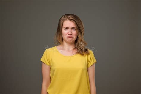 Portrait Of Discontent European Female Frowns Face In Discontent Looks