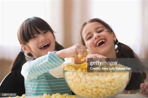 Girl Eating Popcorn Photos And Premium High Res Pictures Getty Images