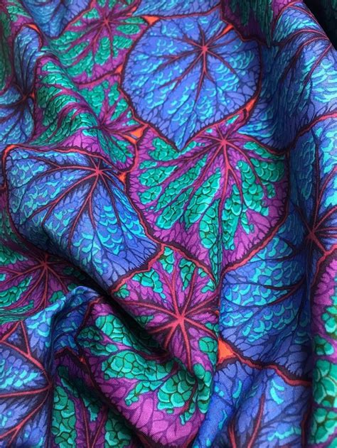 The Fabric Is Very Colorful And Has Leaves On It