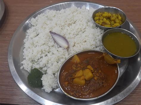 Traditional food of Bangladesh is rice and curry 22319577 Stock Photo