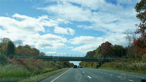 The highway landscape with side view and cloudy sky as background ...