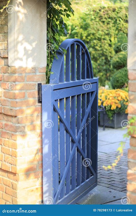 Open Blue Garden Gate Leading Into Botanic Garden Area Stock Image