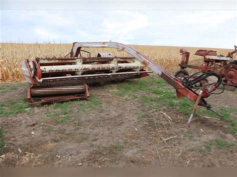 Hesston 1014 Hydro swing swather - Adam Marshall Land & Auction, LLC