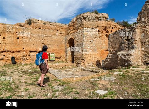 Tourist at entrance gateway to Paderne Moorish castle, Paderne, Algarve ...