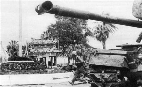 U S Marines Advance Past An M Patton Tank During The Battle For Hu