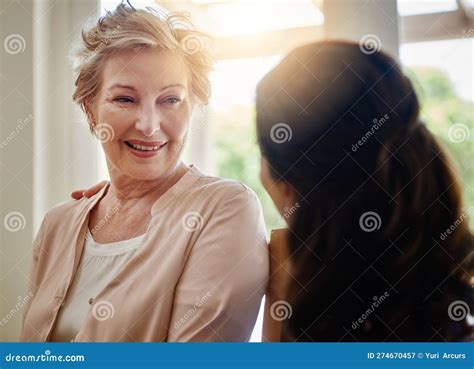 Youre In Good Hands A Smiling Senior Woman Talking With A Nurse In