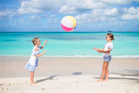 Little adorable girls playing with ball on the beach. Kids having fun on the seashore 17751846 ...