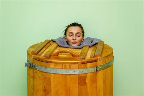 Premium Photo Woman Relaxing In Spa Wooden Hot Tub Barrel Sauna Or Cedar Bathtub