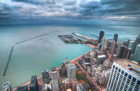 Wallpaper Aerial View Of City Buildings Near Body Of Water During Daytime Background Download