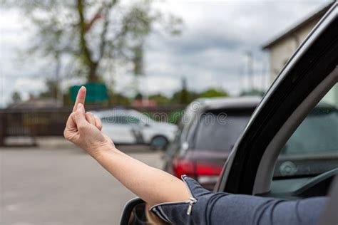 Woman Shows Obscene Gesture From A Car Rude And Furious Driver Giving