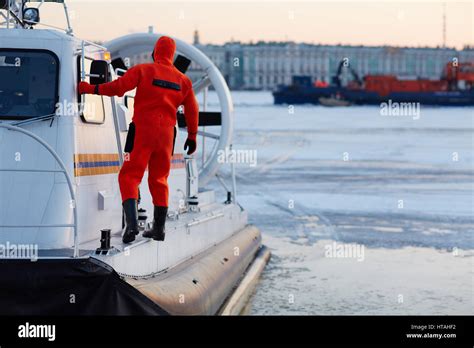 Worker of coast guard team on rescue boat Stock Photo - Alamy