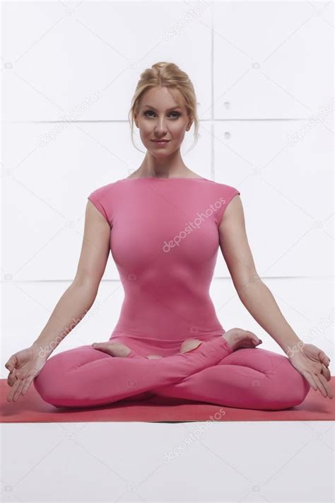 Beautiful Attractive Sexy Blond Woman Doing Yoga Sitting In The Lotus