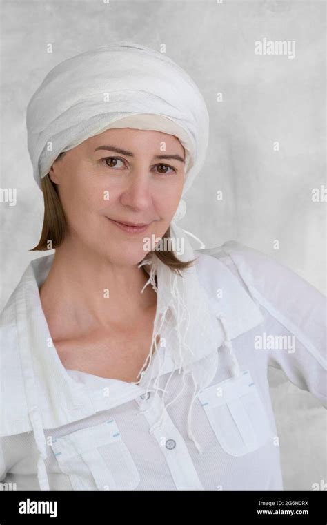 Portrait Of A Smiling 50 Year Old Woman With A Scarf In Hair Stock