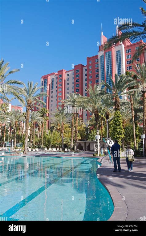 People stand by a pool at the Hilton Grand Vacations Club at the ...