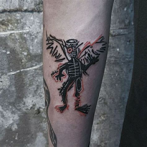 A Man S Leg With A Tattoo On It That Has An Image Of A Bird