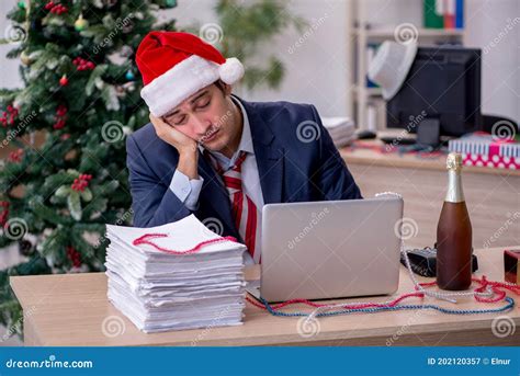 Young Male Employee Celebrating New Year In The Office Stock Image