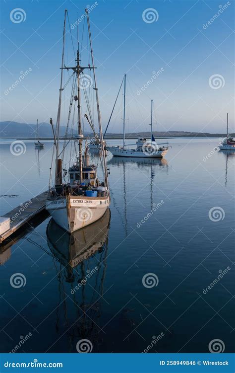 Vertical Shot Of Small Fishing Boats At Dock In Morro Bay California