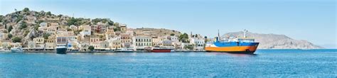 Premium Photo Panorama Of Multicolored Houses On Hills Of Symi Island